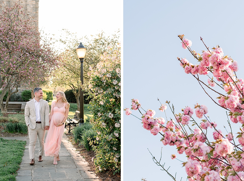 A pregnant woman wearing a pink dress holds her husband's hand during their Baker Park maternity photos in Frederick, Maryland.