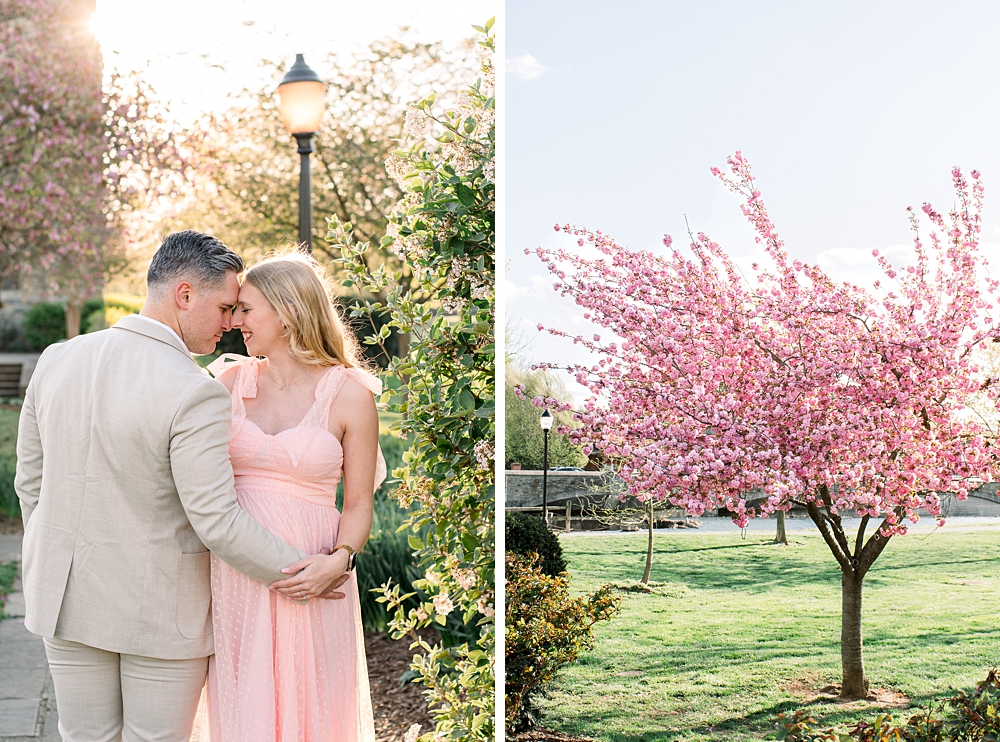 A pregnant woman wearing a pink dress embraces her husband during their Baker Park maternity photos in Frederick, Maryland.