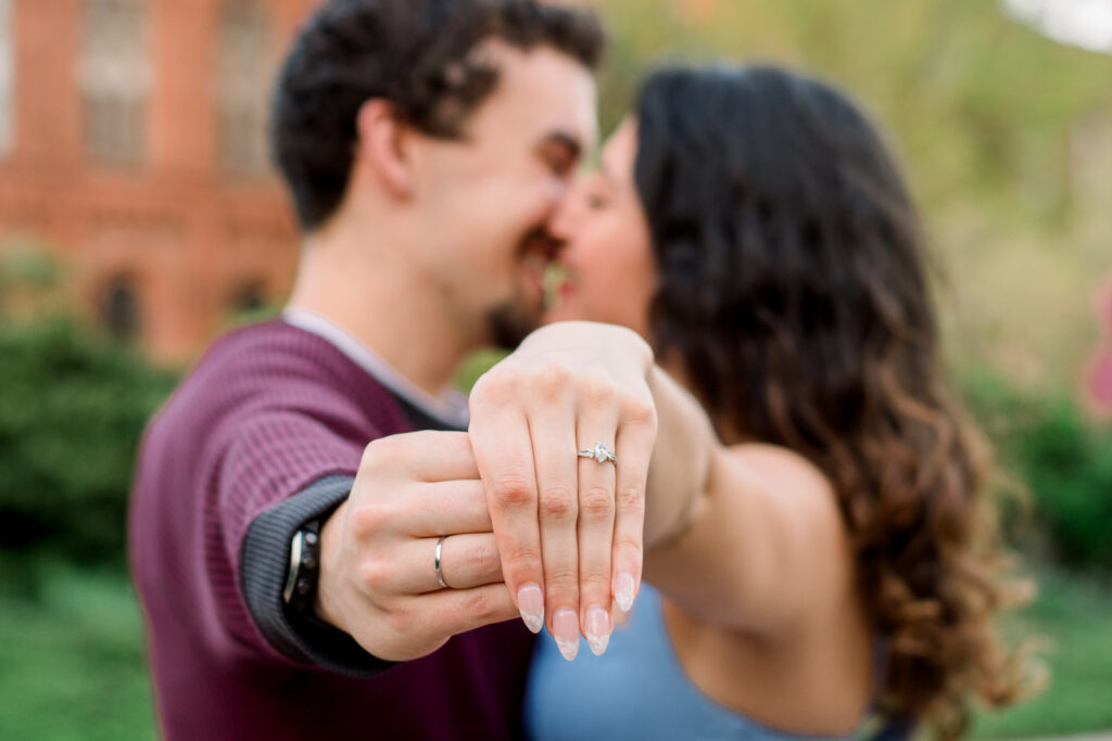 A couple kisses at the Enid A. Haupt Garden at the Smithsonian Castle in Washington D.C.