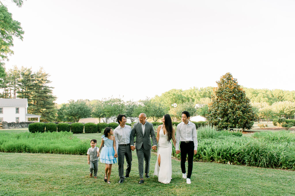 A family looks at one another during their photo session at Rose Hill Manor in Frederick, Maryland.