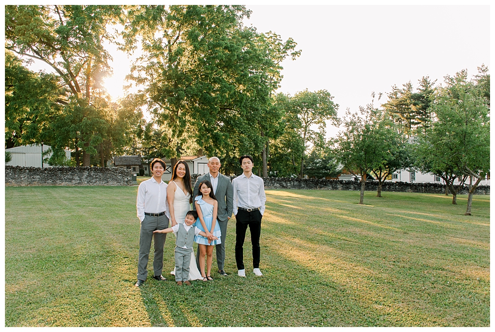 A family stands together for their photo session at Rose Hill Manor in Frederick, Maryland.