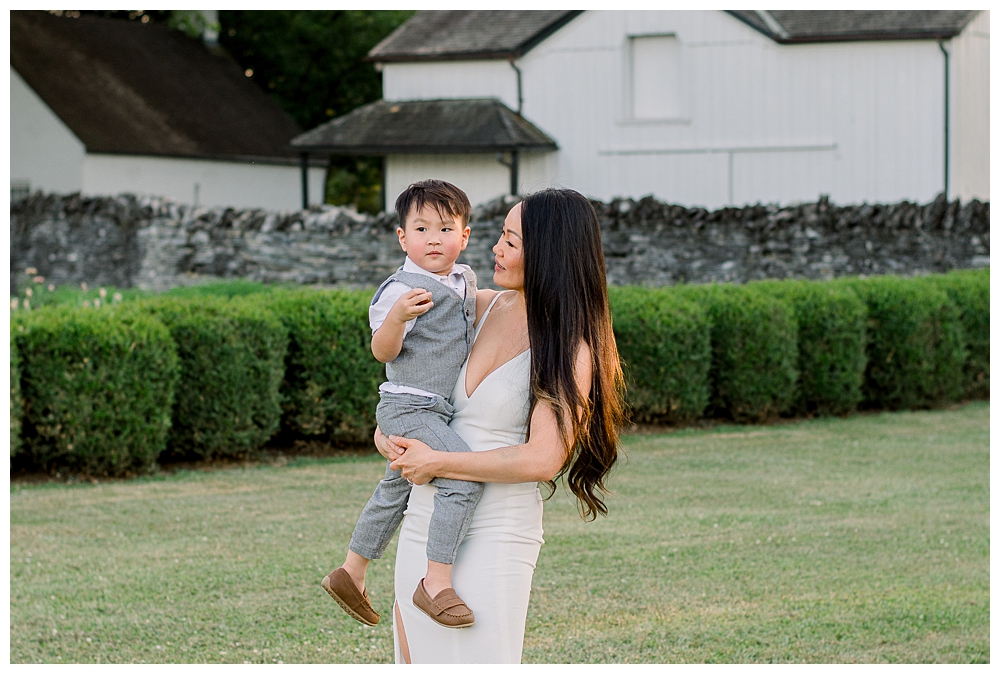 A mom holds her son during their photo session at Rose Hill Manor in Frederick, Maryland.