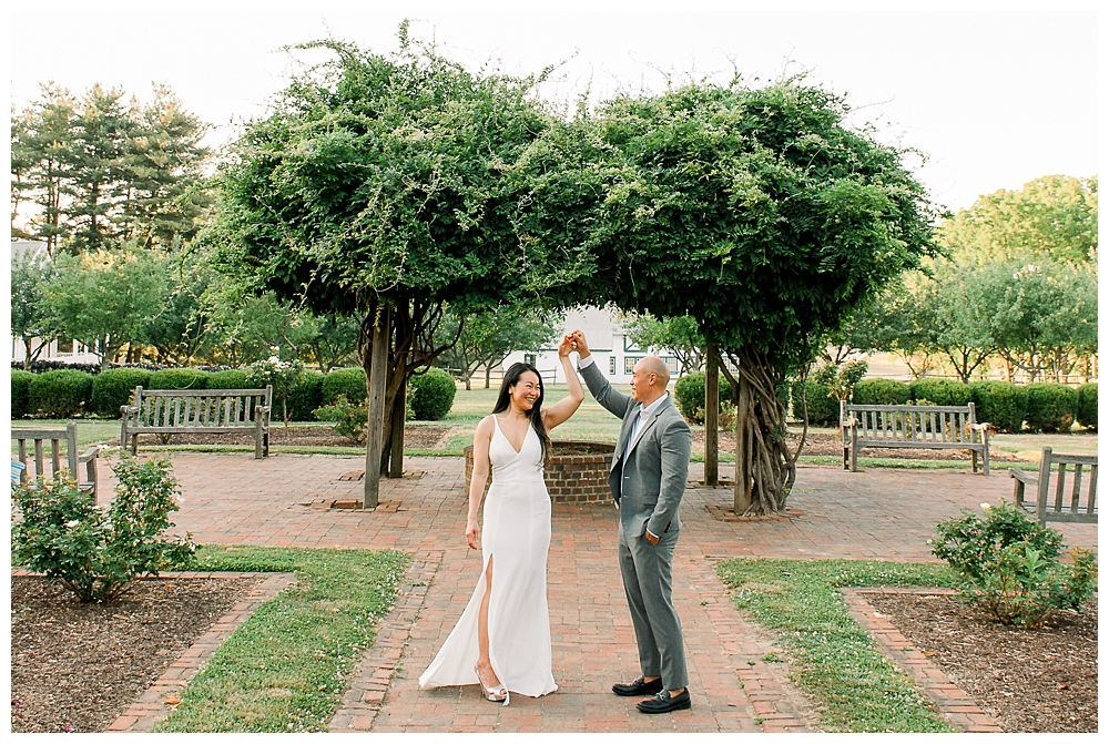 A husband spins his wife during their photo session at Rose Hill Manor in Frederick, Maryland.