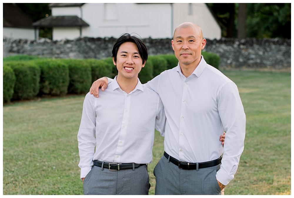 A father and son stand side by side during their photo session at Rose Hill Manor in Frederick, Maryland.