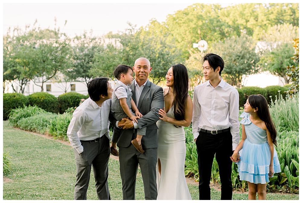 A family looks at one another during their photo session at Rose Hill Manor in Frederick, Maryland.