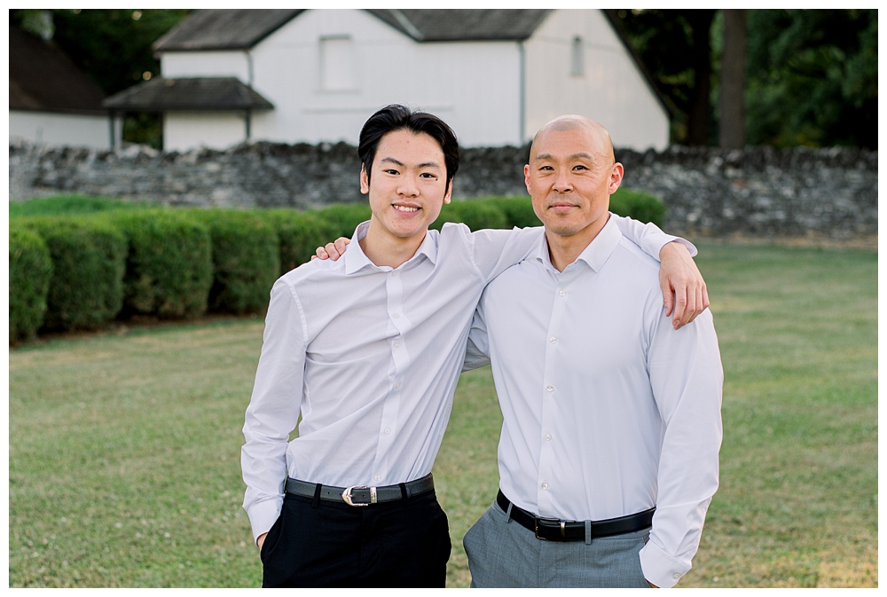A father and son stand side by side during their photo session at Rose Hill Manor in Frederick, Maryland.